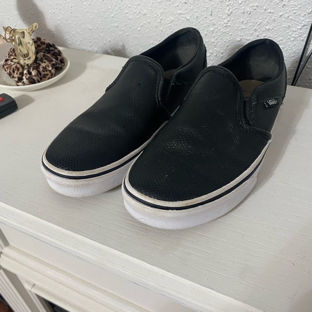 Black and white slip on vans